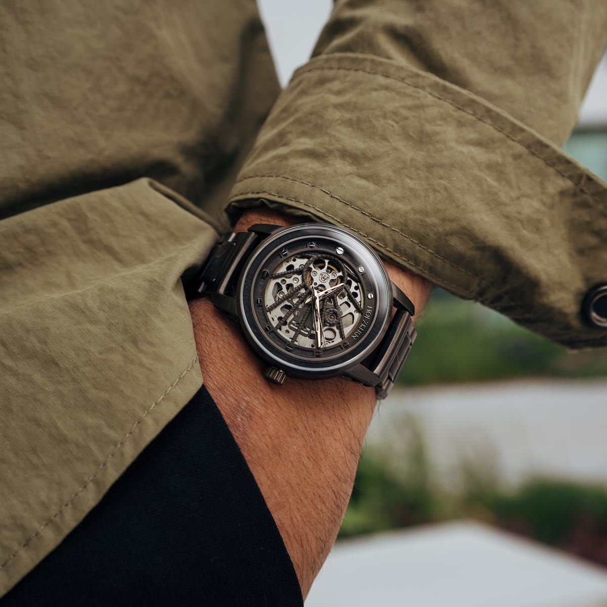 "Carbon" watch featuring a skeleton design in a sleek gray maple and dark gray style.