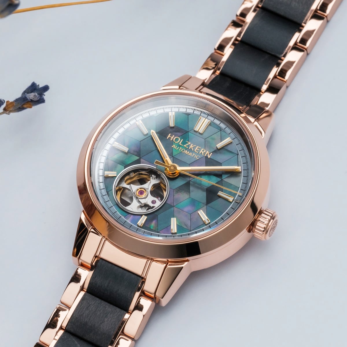 "Luminaire" watch, featuring a nacre and maple design with a rose gold strap and intricate detailing.