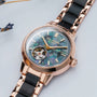 "Luminaire" watch, featuring a nacre and maple design with a rose gold strap and intricate detailing.