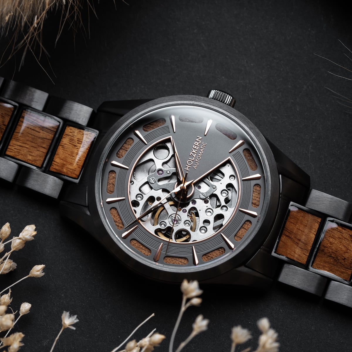"Tenoumer" watch featuring a Koa wood and dark gray design with a detailed skeleton dial.