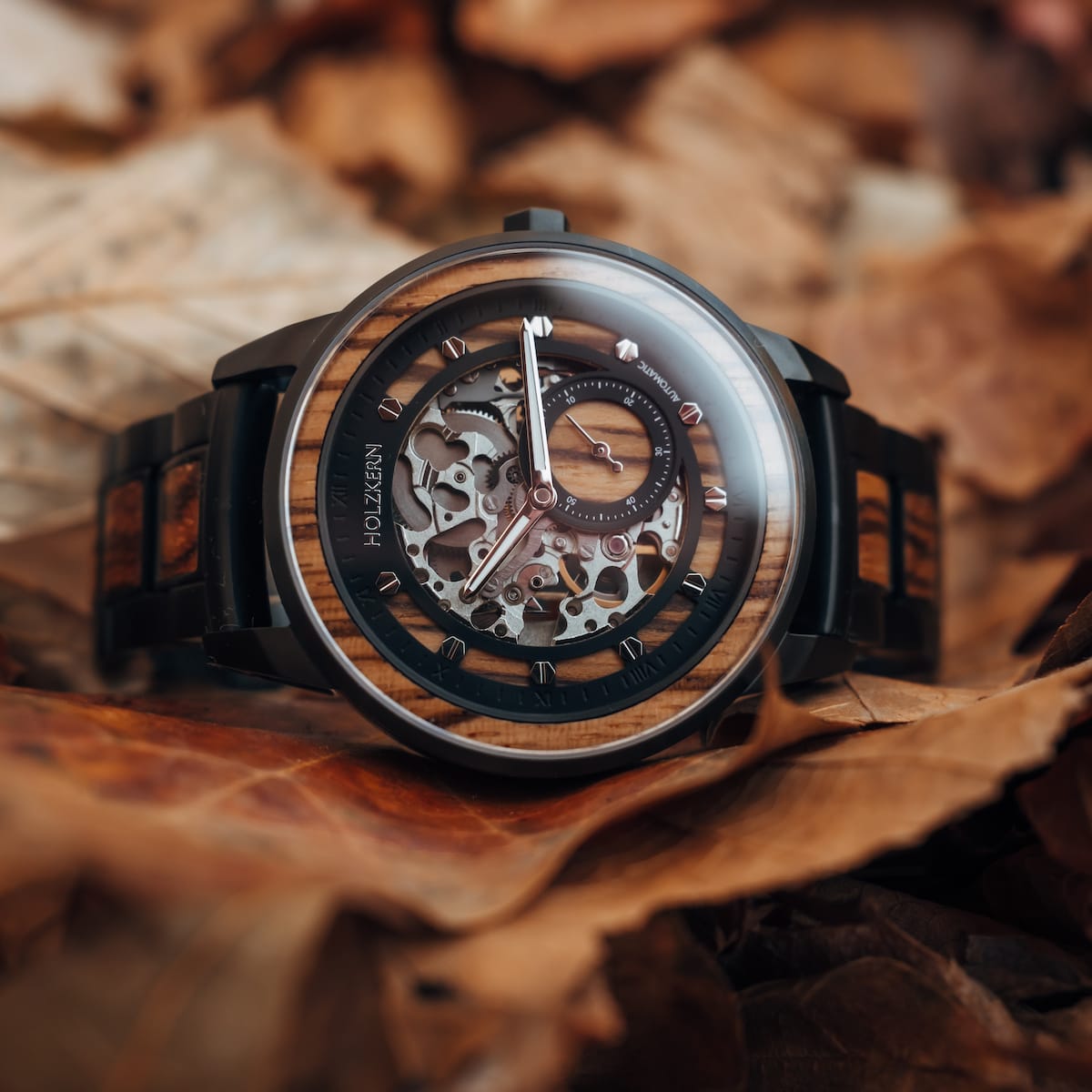 "Sternum" watch with zebrawood and black accents, featuring a sophisticated skeleton dial design.