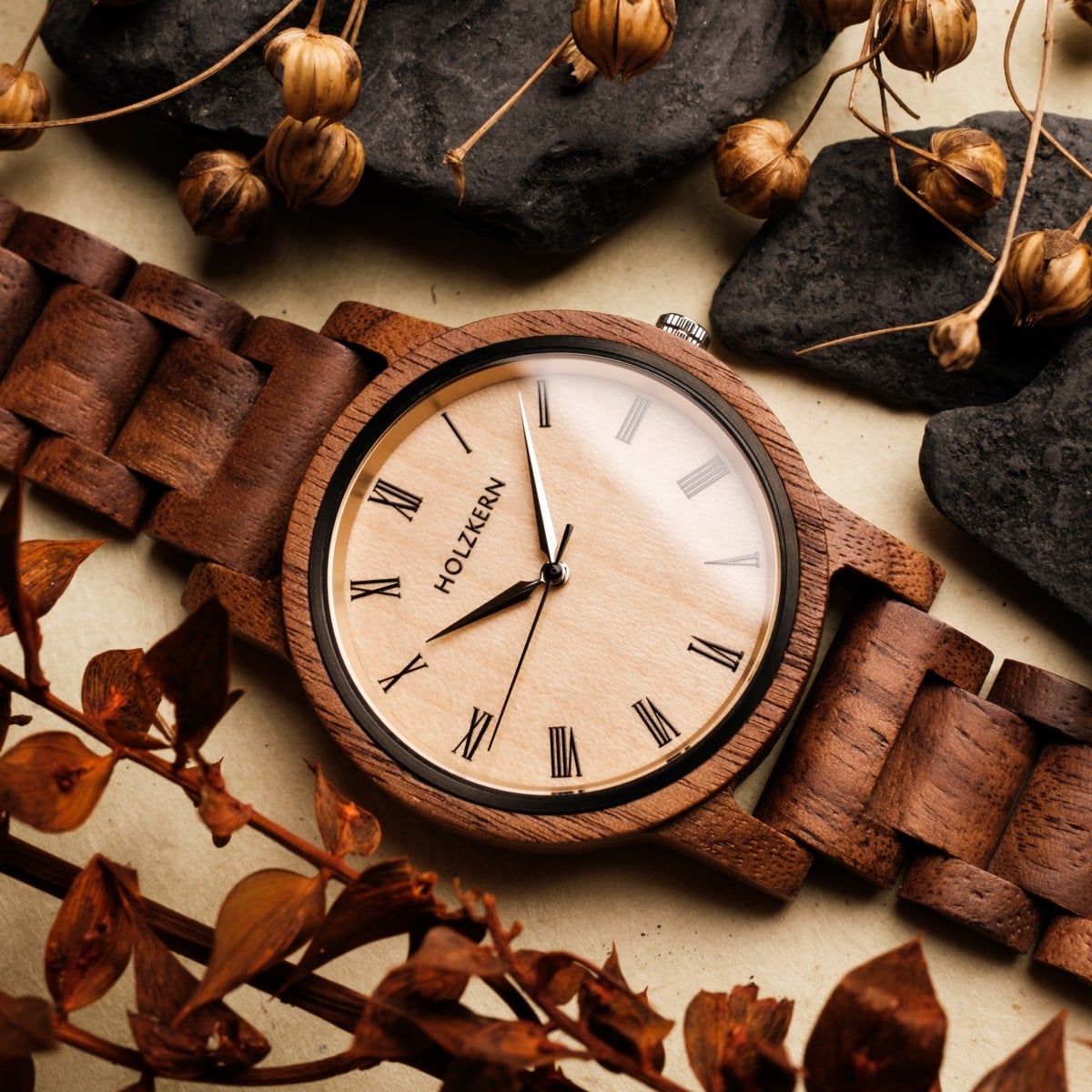 "Fall Dusk", a wooden watch with a walnut and maple design, paired with rustic autumn elements.