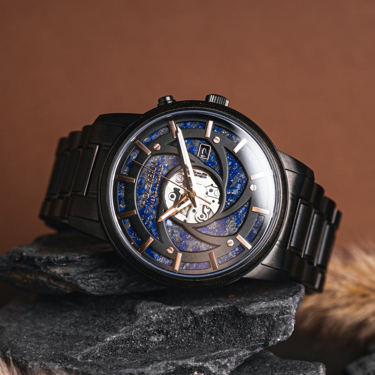 "Seaburst" watch featuring a maple and lapis lazuli design with intricate detailing and a sleek, modern aesthetic.