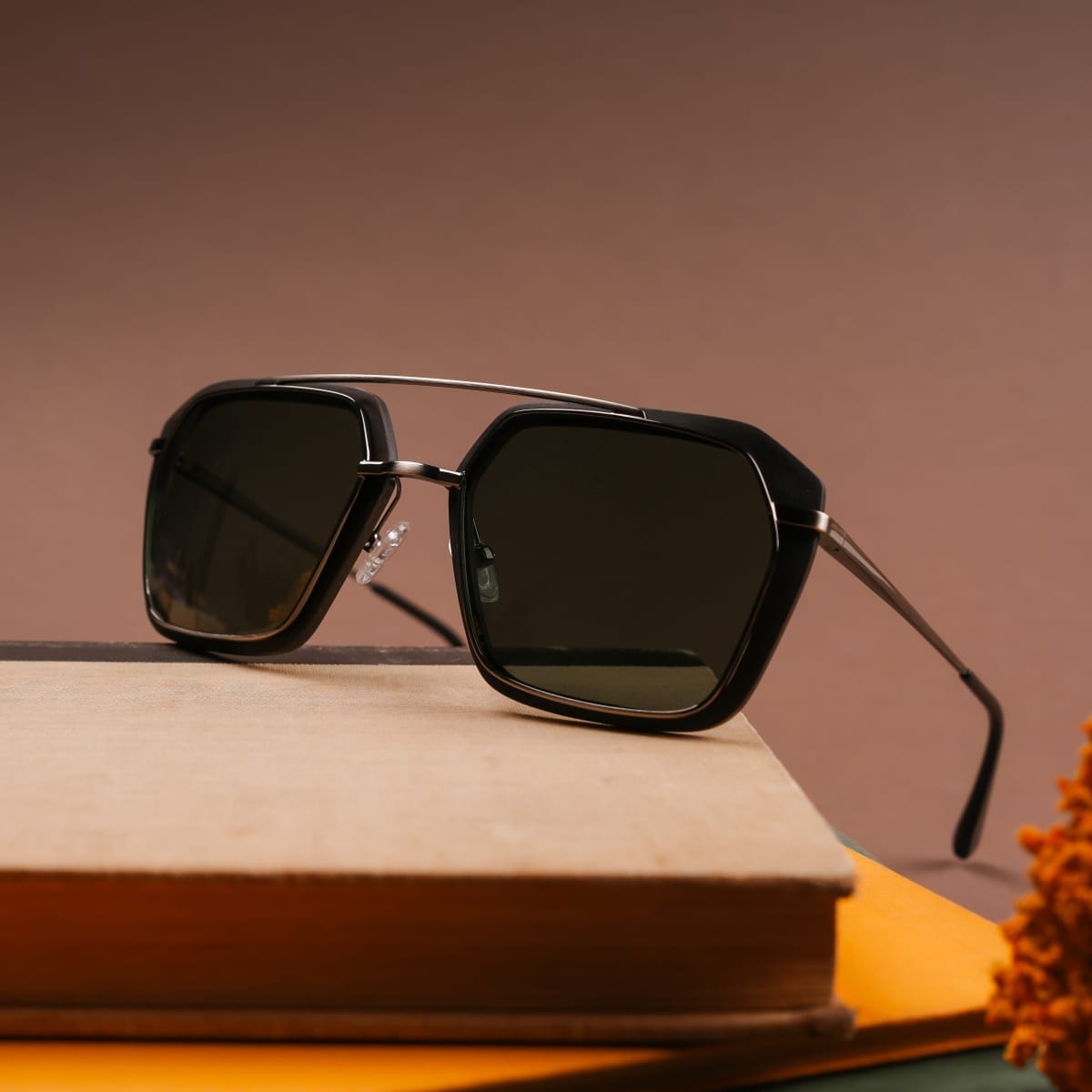 "The Storyteller sunglasses feature a sleek design with leadwood frames and antique silver accents."