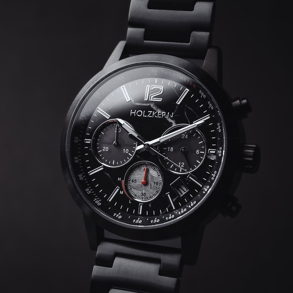 "Rahotu" wristwatch featuring a marble and black design, with a sleek, stylish appearance.