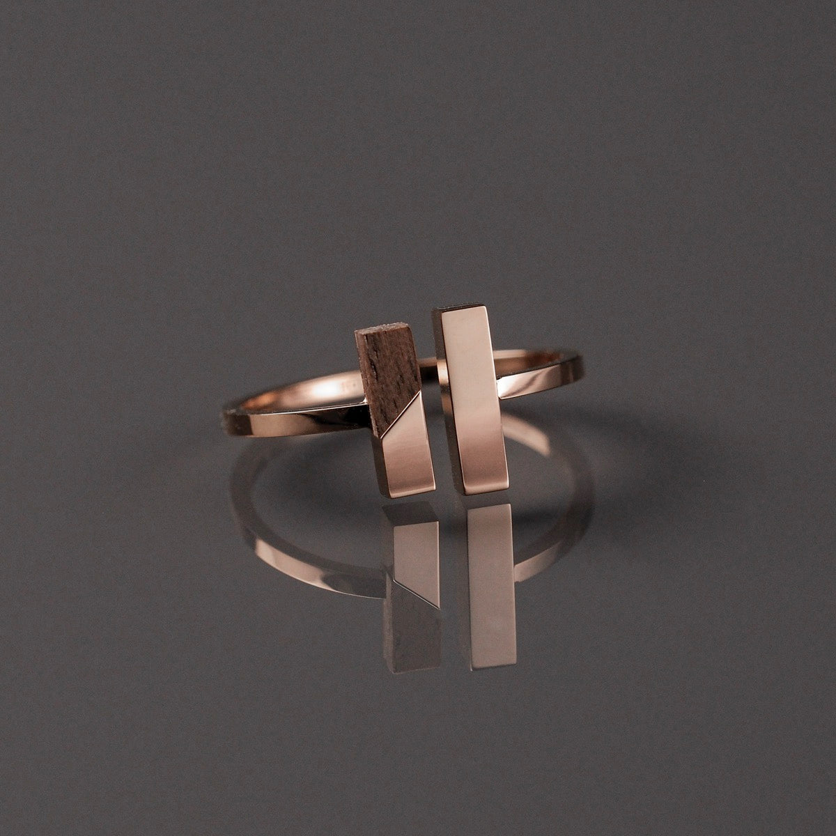 "Campania Ring", a stylish walnut and rose gold ring with a modern geometric design.