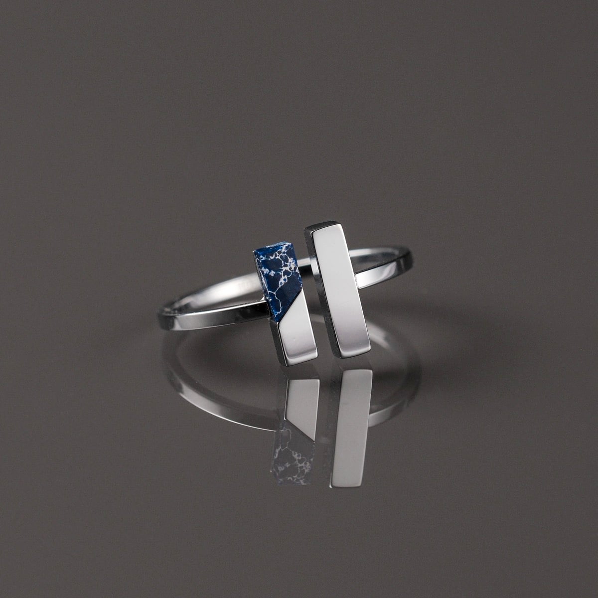 "Campania Ring", a modern lapis lazuli and silver ring with sleek, minimalist design.