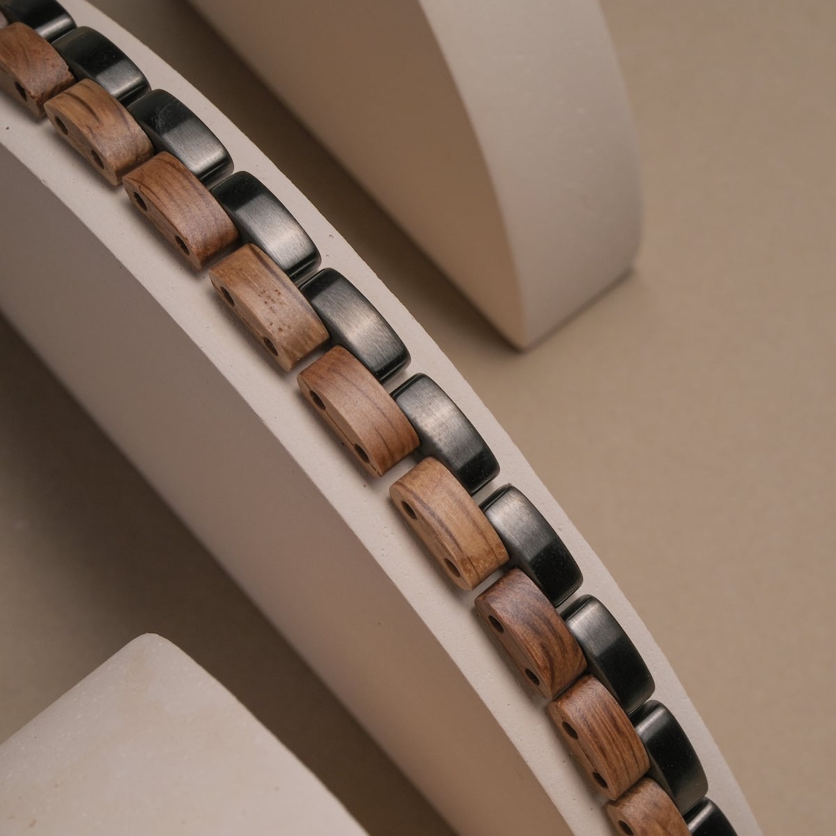 "Duet" bracelet featuring oak and gray elements with a sleek, modern design.