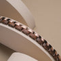 "Duet" watch strap featuring a stylish walnut and rose gold design.