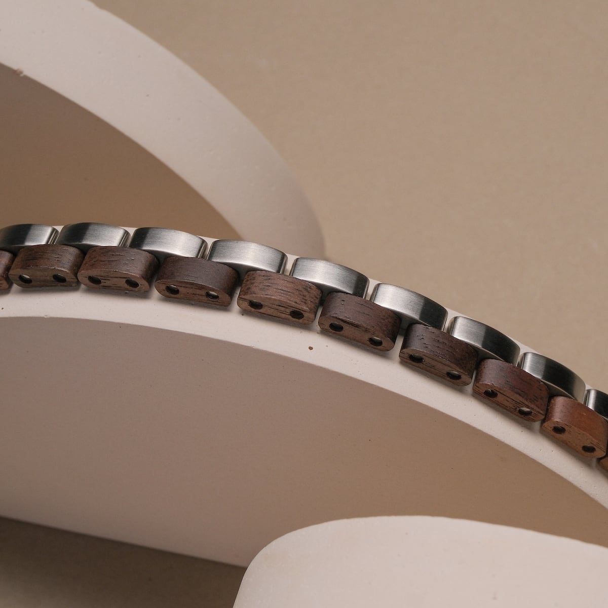 "Duet" bracelet featuring a stylish blend of walnut wood and silver accents in a modern design.