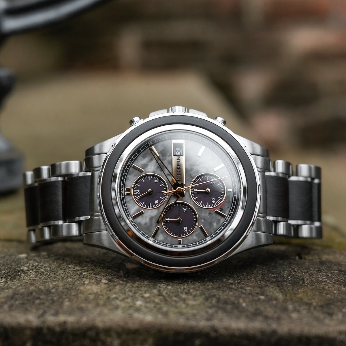 "Cairo" watch featuring a refined marble and maple design with a sleek, modern style.