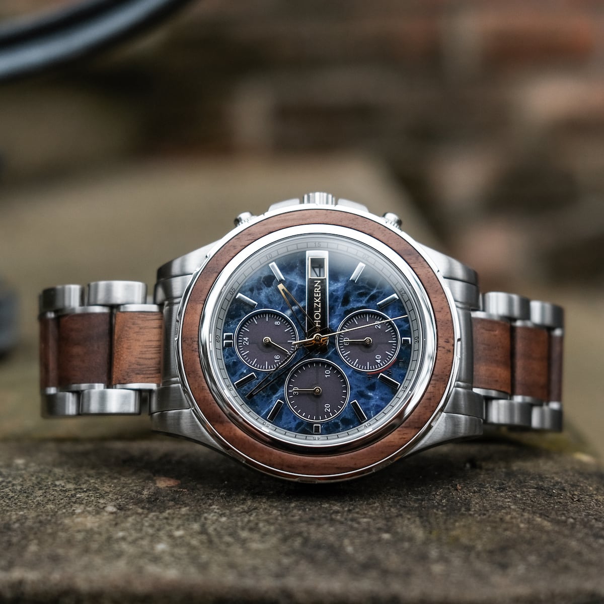 "Koh Mak" watch featuring a walnut and marble design with a polished, sophisticated style.