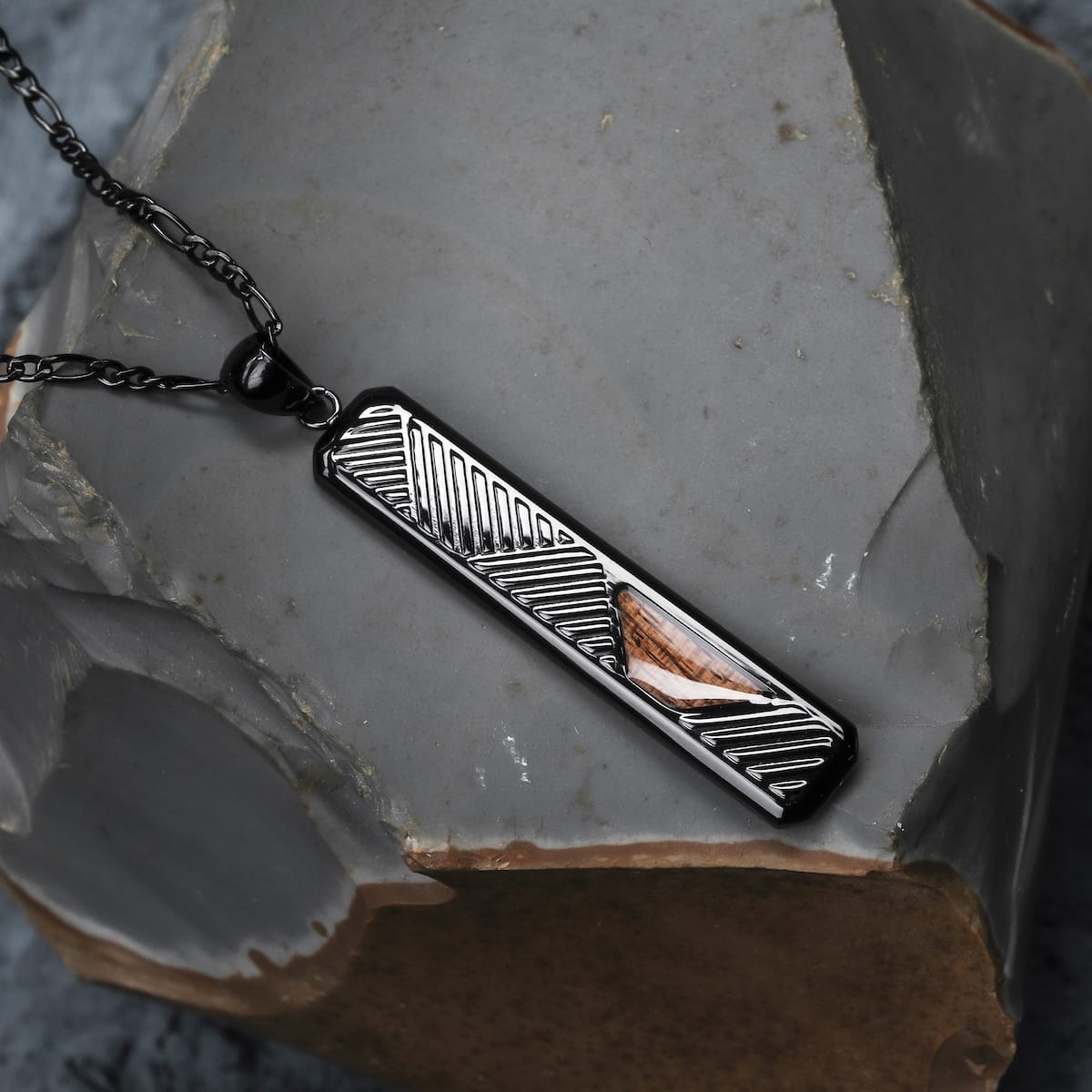 "Derivatives Necklace" necklace with a modern zebrawood and black design, featuring geometric and natural elements.