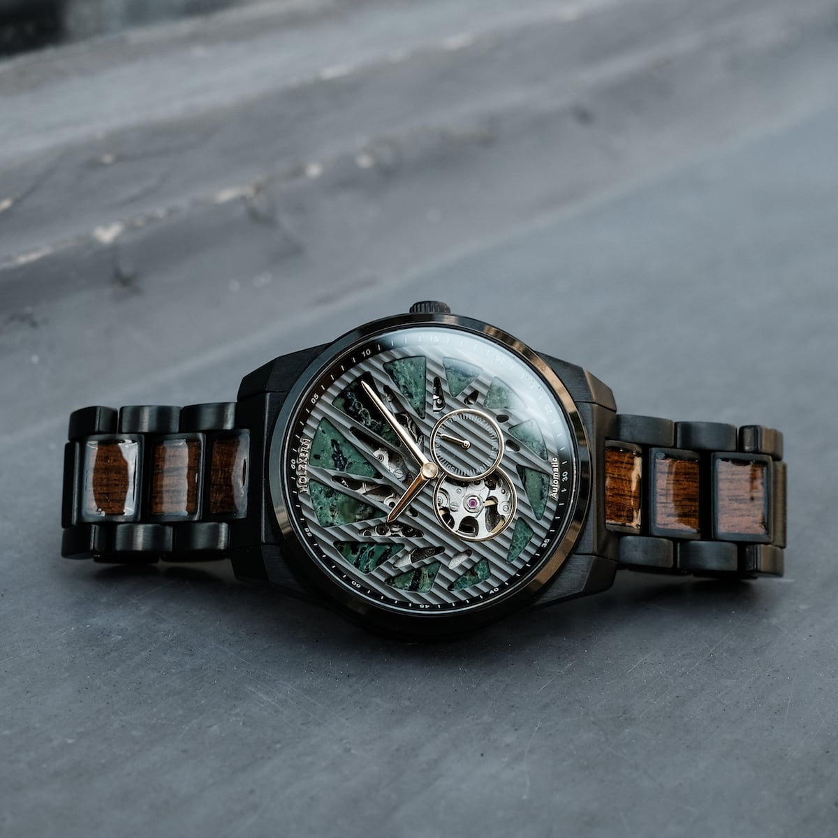 "Adrenin watch featuring a Cat's Eye pattern and walnut accents, with an intricate dial design and stylish metal band."