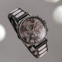 "Breezy watch featuring a marble-style dial and ceramic accents with a sleek, sophisticated design."