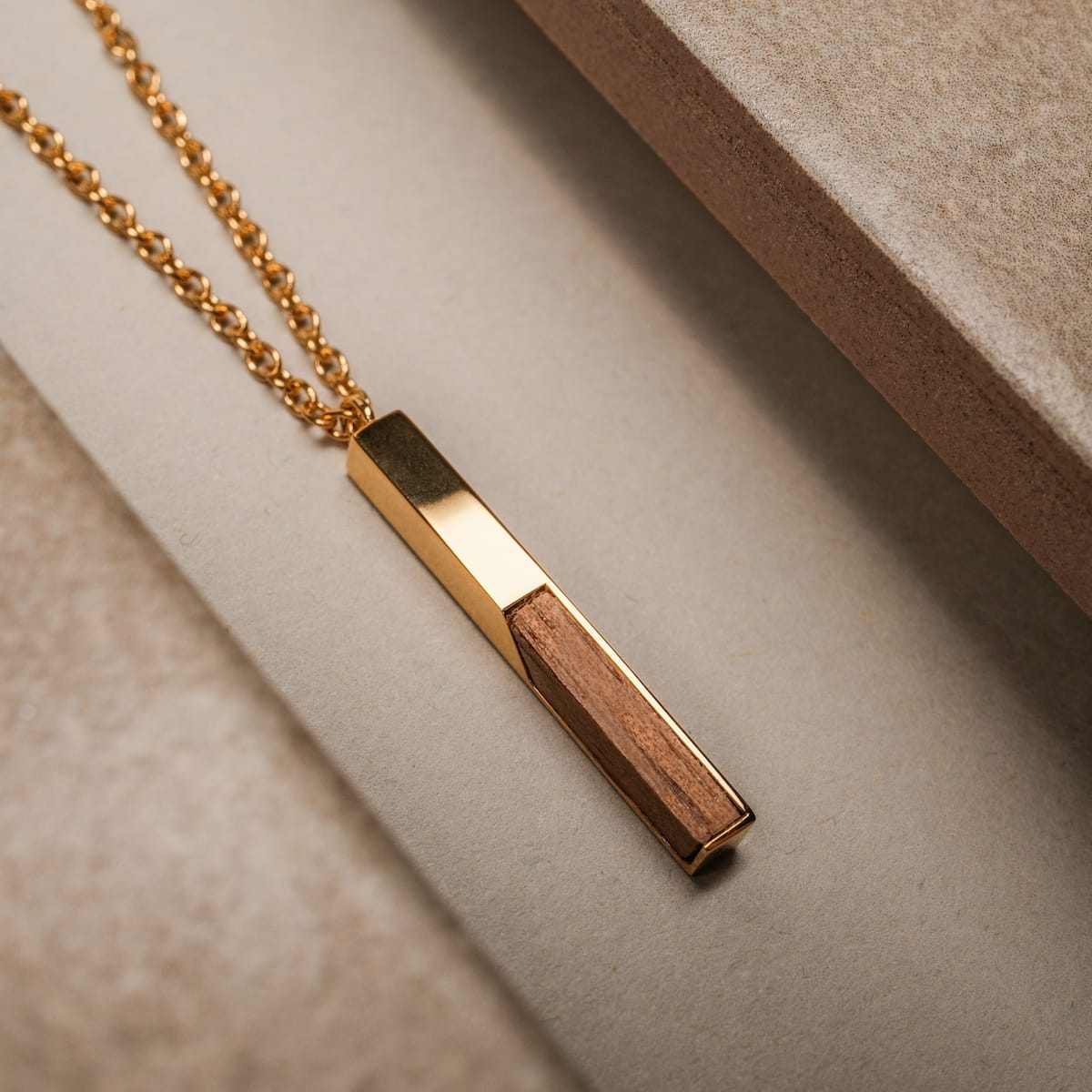 "Campania Necklace" necklace, koa wood and gold, elegant rectangular pendant on a gold chain.