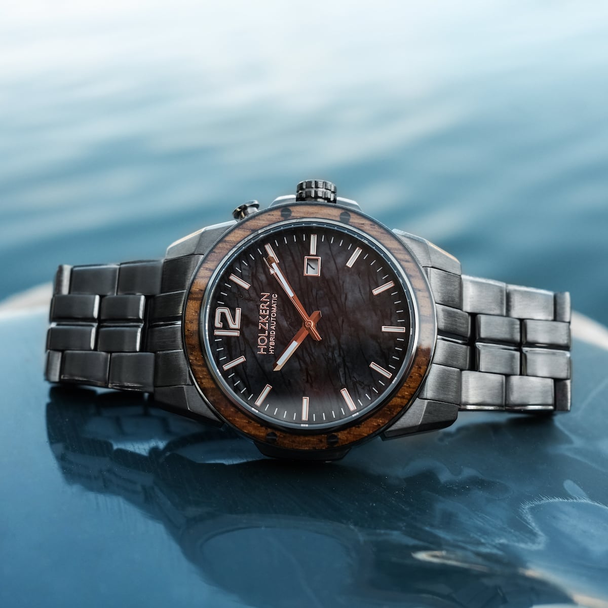 "Frostheave" watch featuring a marble and zebrawood design with a sleek, elegant style.