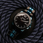 "Glaciersurge" wristwatch featuring a sleek design with Hawk's eye face and maple accents.