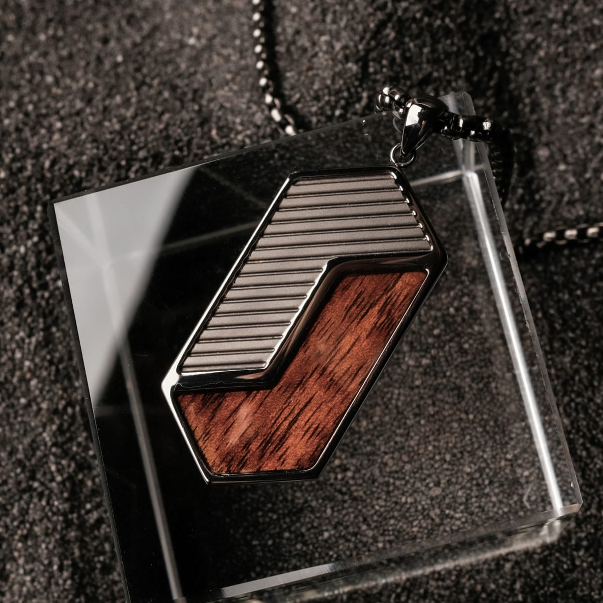 "Zigzag Necklace" necklace featuring a geometric walnut and dark gray design.