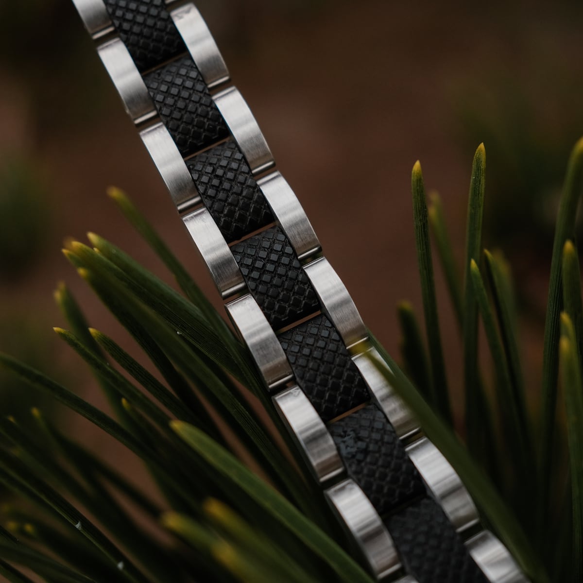 "Accord" watch band featuring a sleek Maple and Silver design with textured accents.