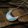 "Hue Necklace", crescent moon necklace in blue nacre and rose gold, with an elegant, earthy style.