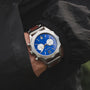 "Osprey wristwatch with a striking azure blue dial and silver casing, offering a bold and sophisticated style."