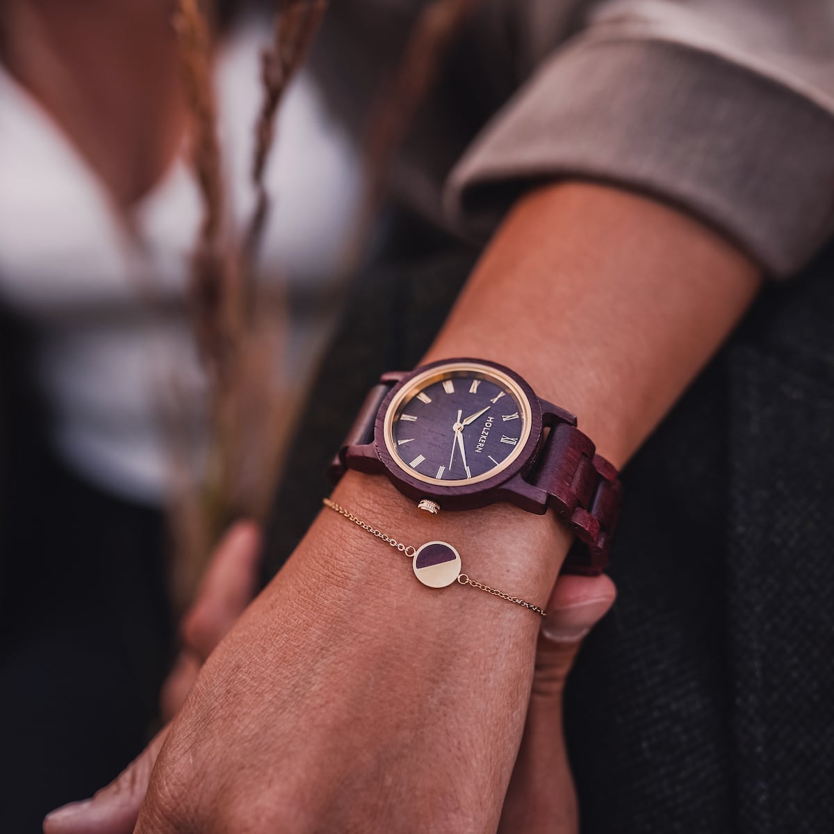 "Calm" watch in amaranth, featuring a sleek, elegant design with a rich, warm color scheme.
