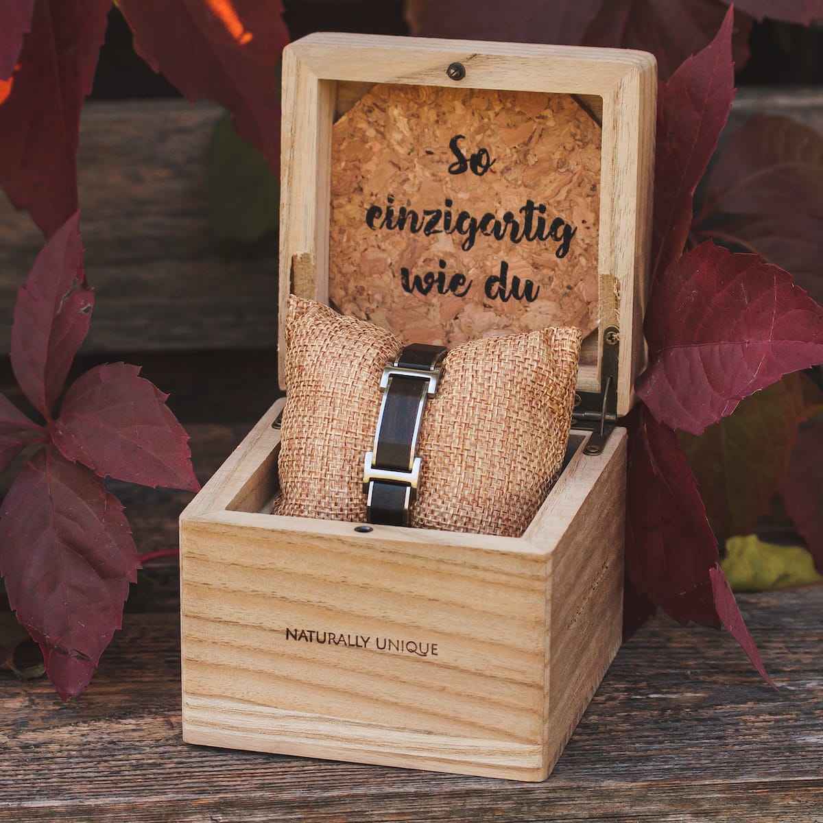 "Acapella" watch in a rustic wooden box, showcasing a Leadwood and Silver design.