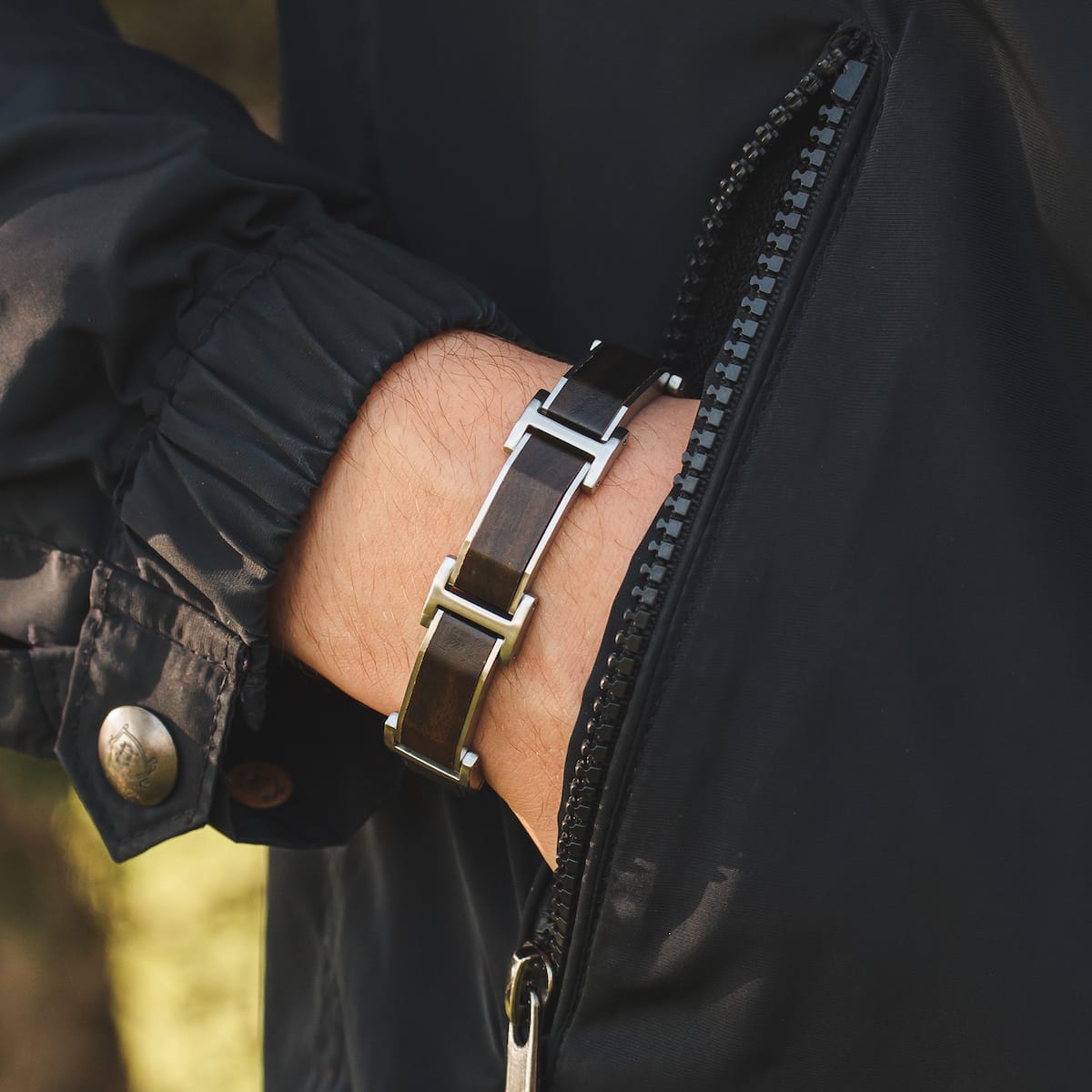"Acapella" bracelet featuring leadwood and silver accents in a sleek, modern design.
