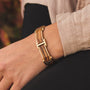 "Acapella" bracelet featuring zebrawood and gold with a stylish and modern design.