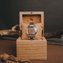 "Gaudí" watch, crafted with walnut wood, featuring a sleek, natural design in a wooden box.