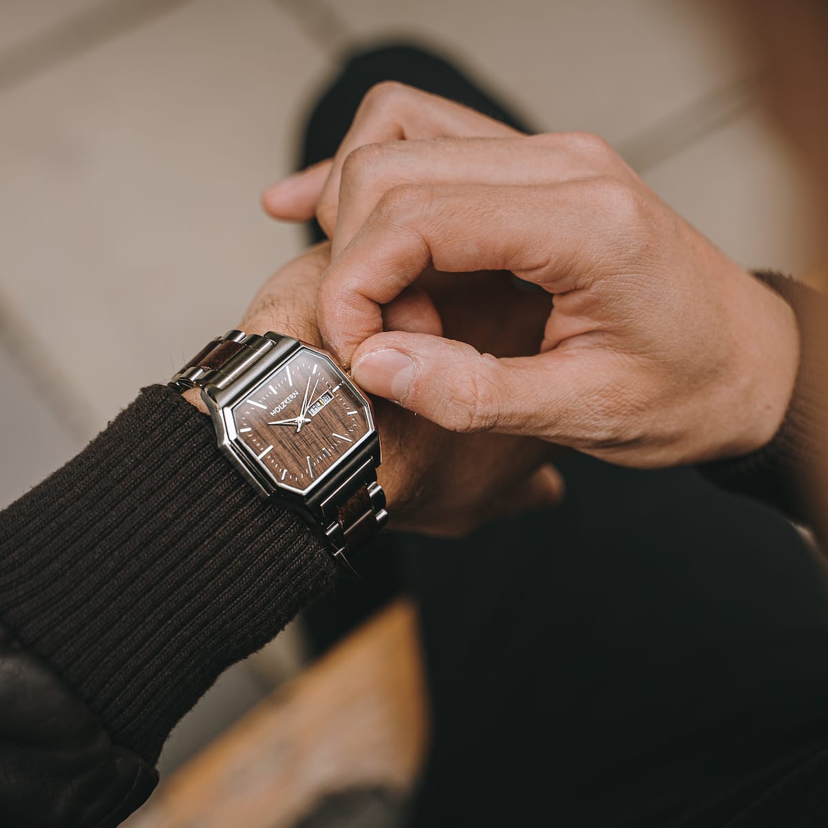 "Gaudí" watch, featuring a walnut and steel design with a sleek, modern style.