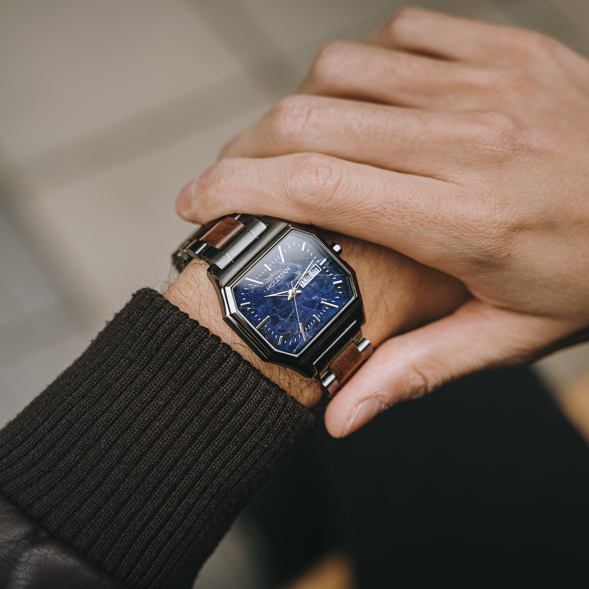 "Moneo" watch featuring a sophisticated blend of koa wood and marble elements with a stylish design.