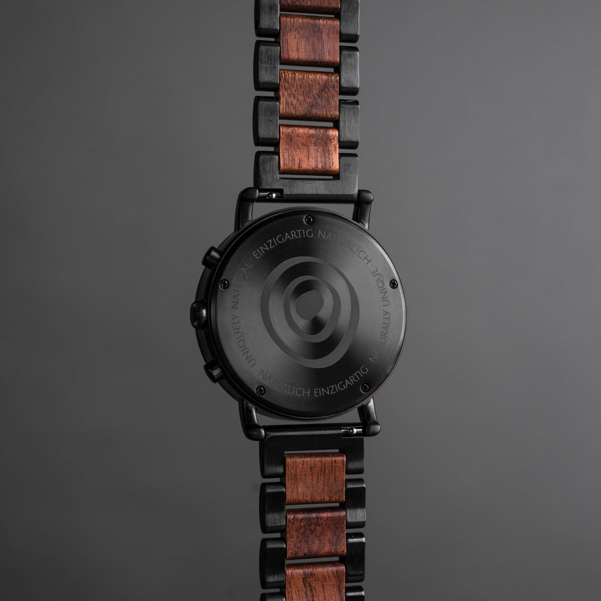 "Dusk" watch with walnut and black finish, showcasing a sleek and modern design.