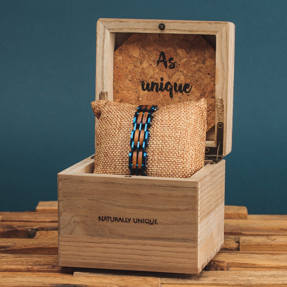 "Adagio" is a stylish watch featuring a koa wood and blue design, presented in a wooden box with a natural aesthetic.