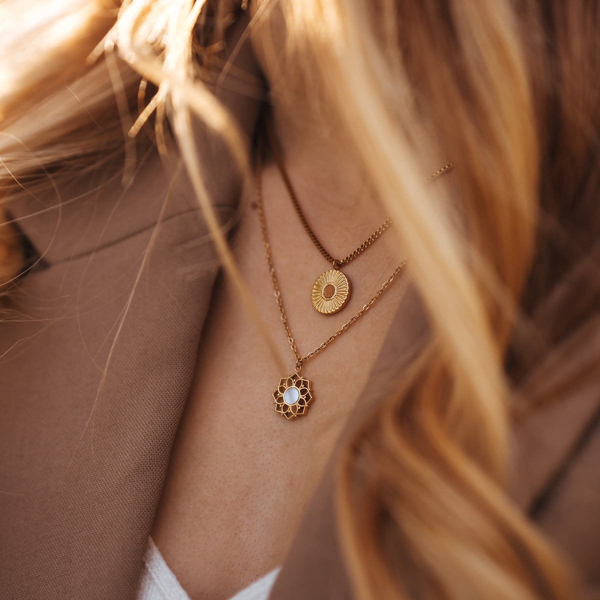 Stencil Necklace, a stylish gold and koa wood necklace with intricate circular designs.