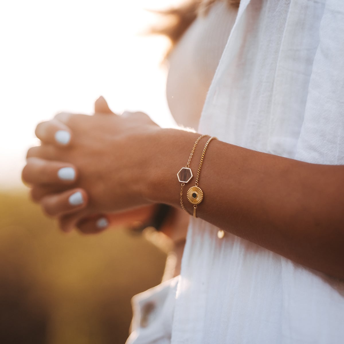"Facade Bracelet" bracelet, featuring elegant walnut and gold design on a delicate chain, exuding a chic, minimalist style.