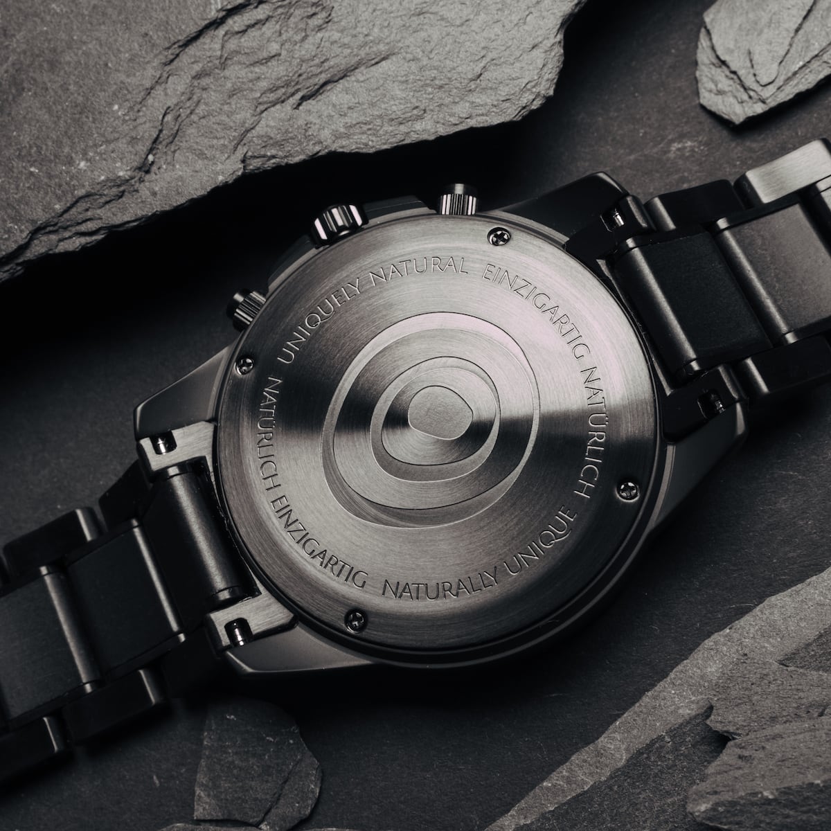 "Lucan" watch features a sleek, industrial design with maple and marble accents for a sophisticated look.