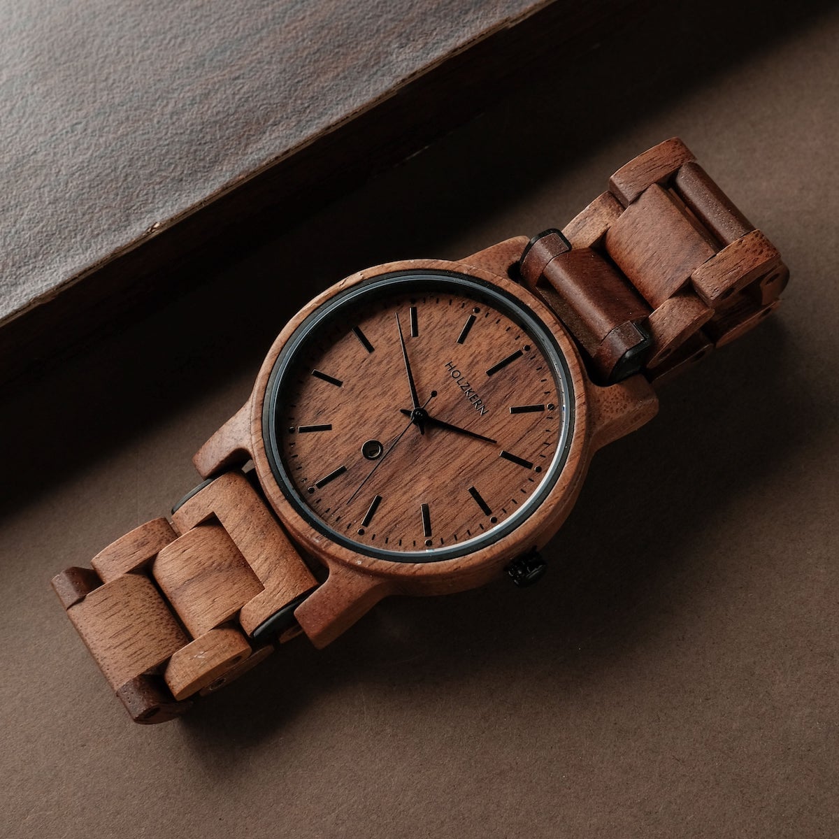 "Rilke" watch featuring a Walnut wood design with a classic strap style.