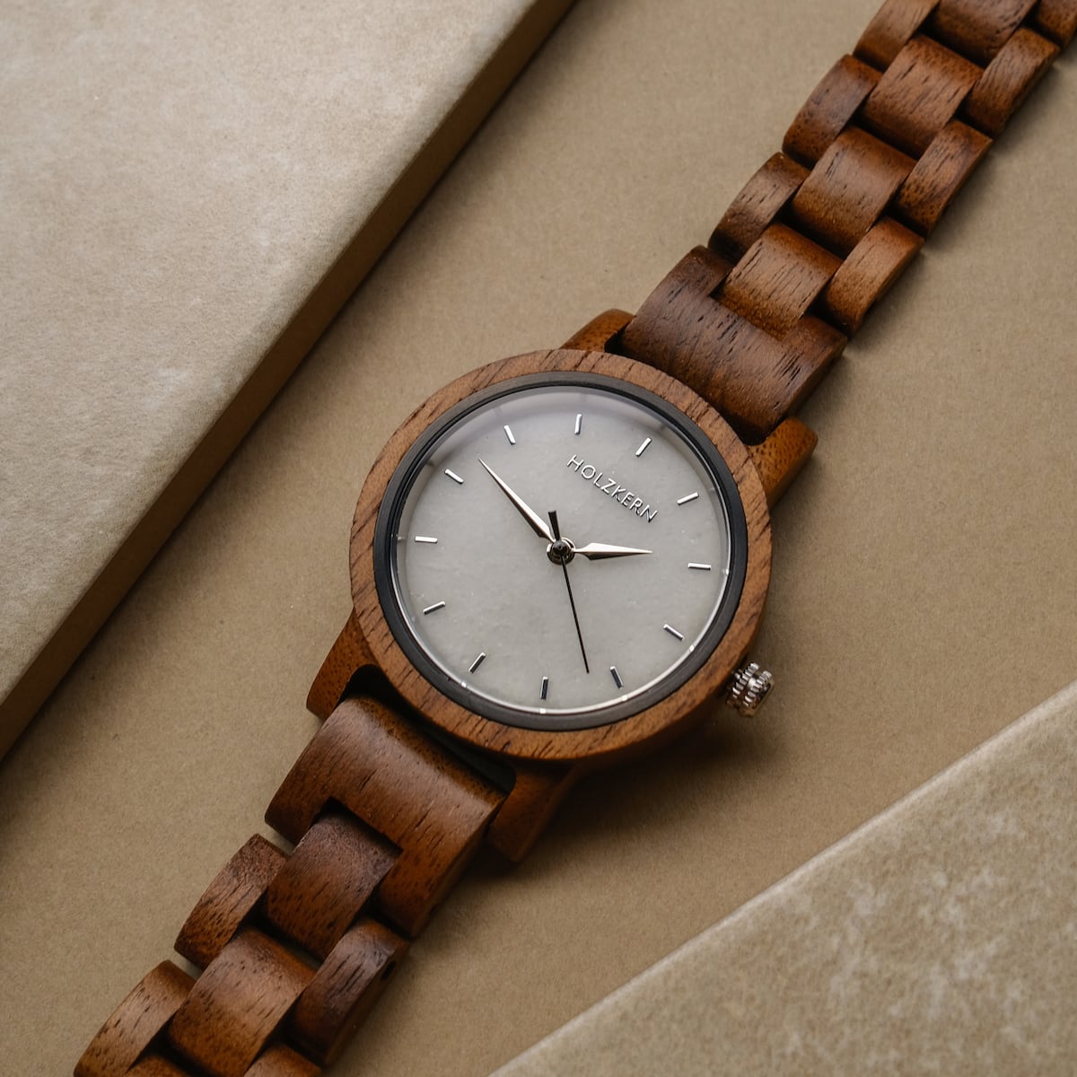 "Air" watch featuring a walnut wood band and marble face, showcasing an elegant, natural style.