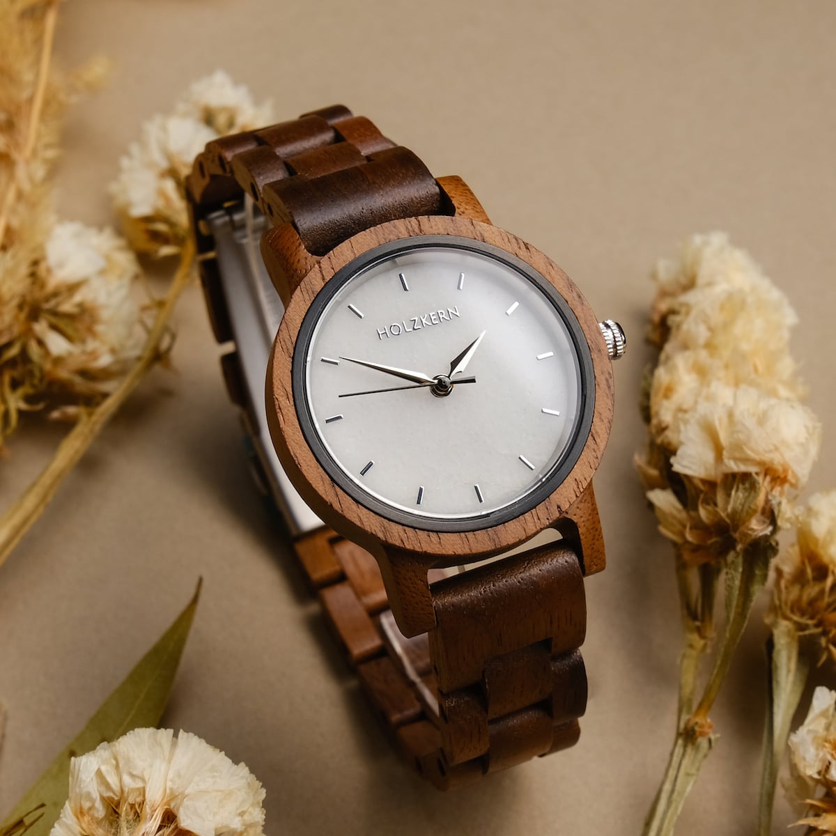 "Air" watch with walnut wood and marble accents, featuring a minimalist design and earthy tones.