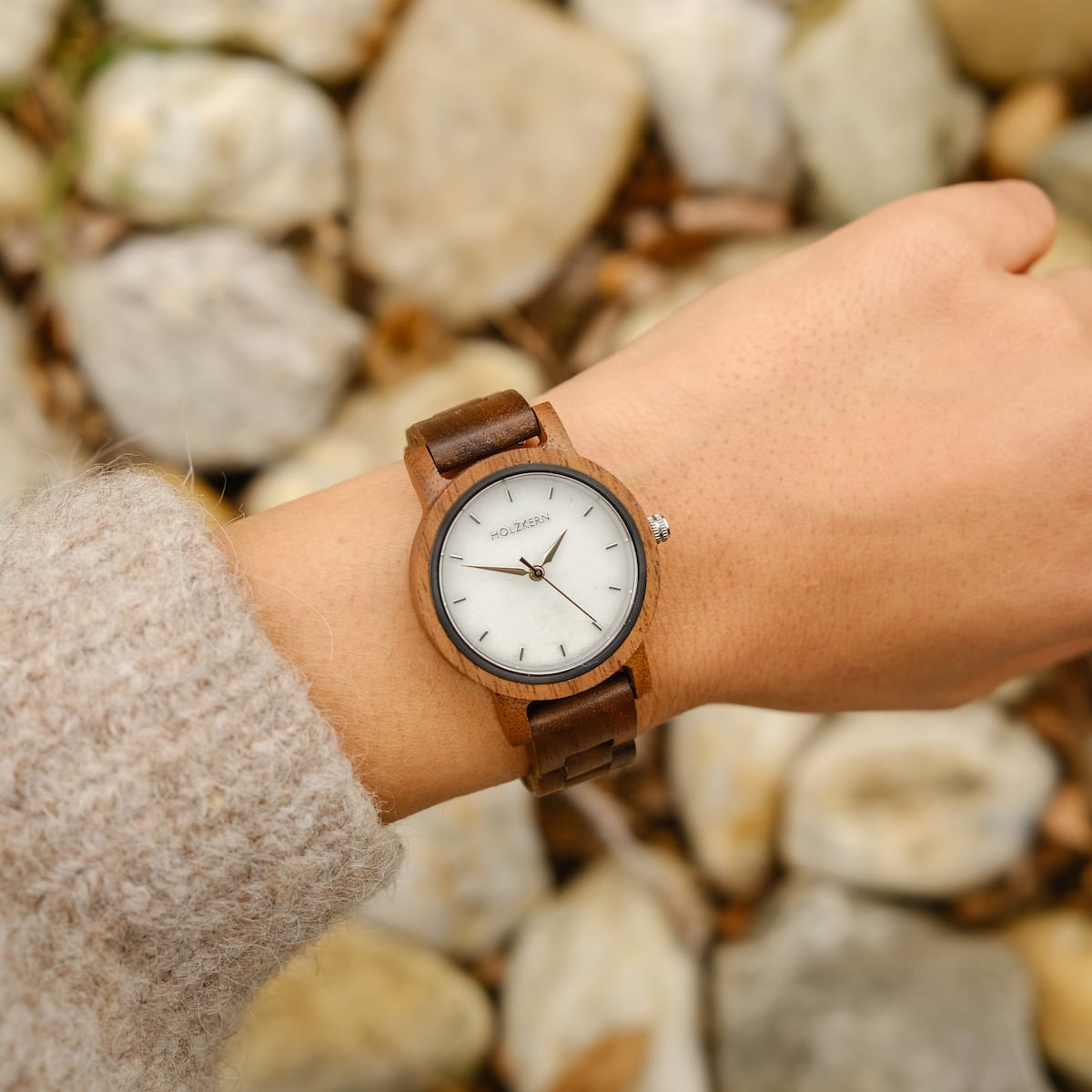 "Air" watch, featuring a walnut wood frame and marble-style dial for an elegant look.