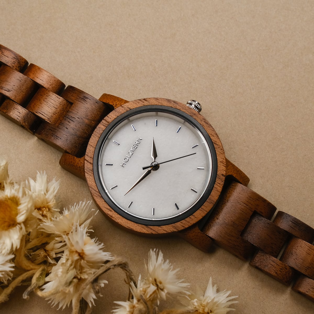 "Air" wristwatch with walnut wood band and marble face, showcasing a natural and elegant design.