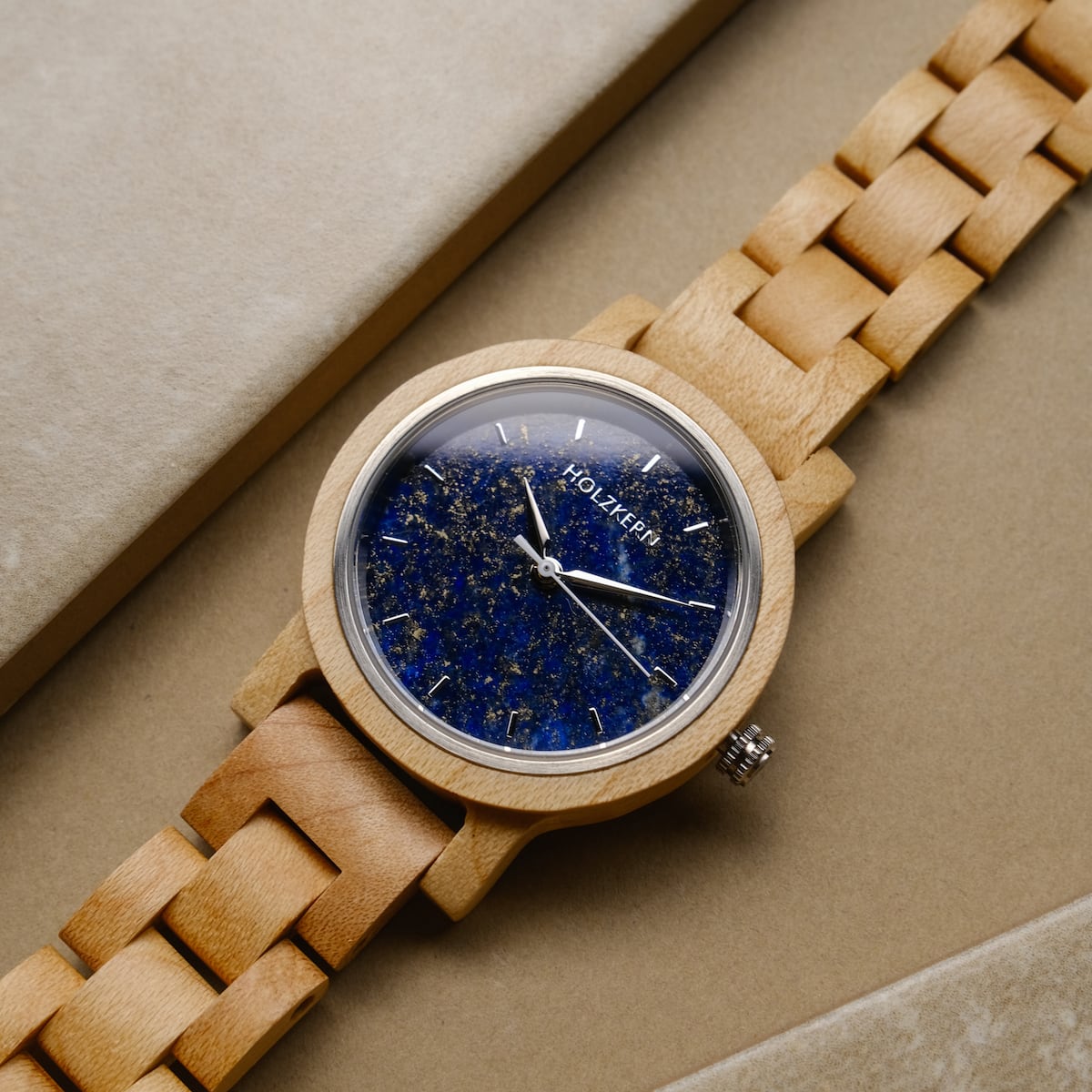 "Water" wooden watch featuring a maple case and lapis lazuli-inspired face design.
