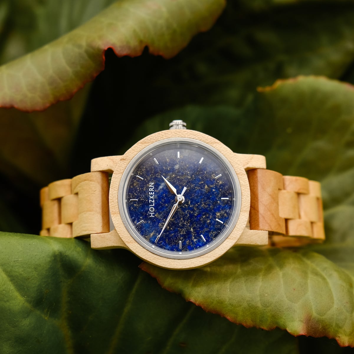 "Water" watch featuring a maple wood band and lapis lazuli face, displayed with a natural, rustic aesthetic.