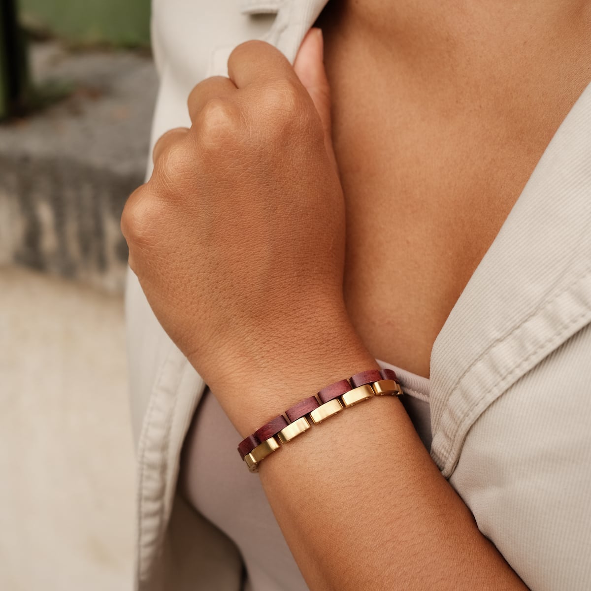 "Duet" bracelet featuring amaranth wood and gold elements in an elegant, modern style.
