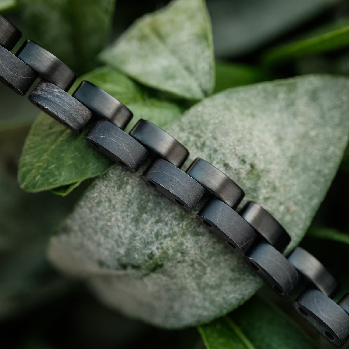 Duet bracelet with maple and black design, featuring a sleek and modern style.
