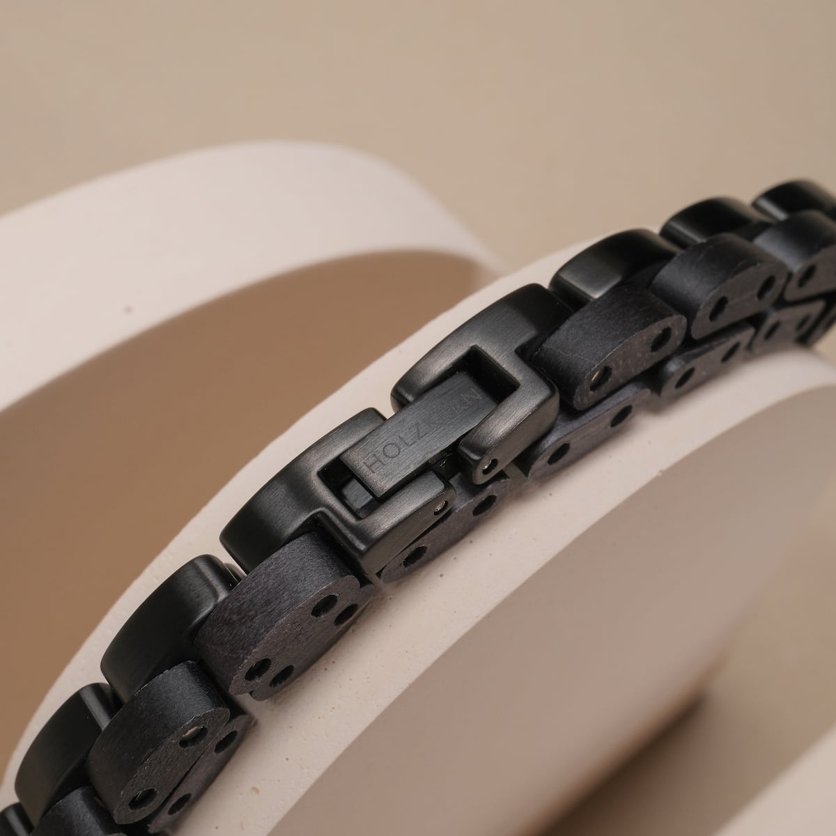Duet bracelet featuring a sleek black and maple design with a modern, minimalist aesthetic.