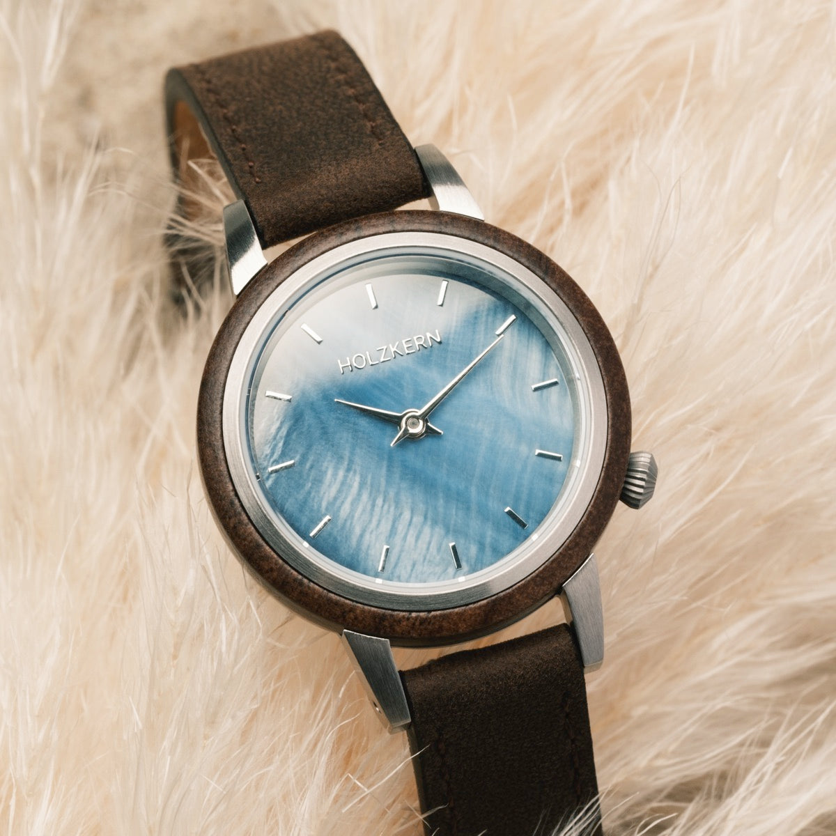 "Côte d'Azur" watch featuring walnut wood and nacre accents with a stylish, natural aesthetic.