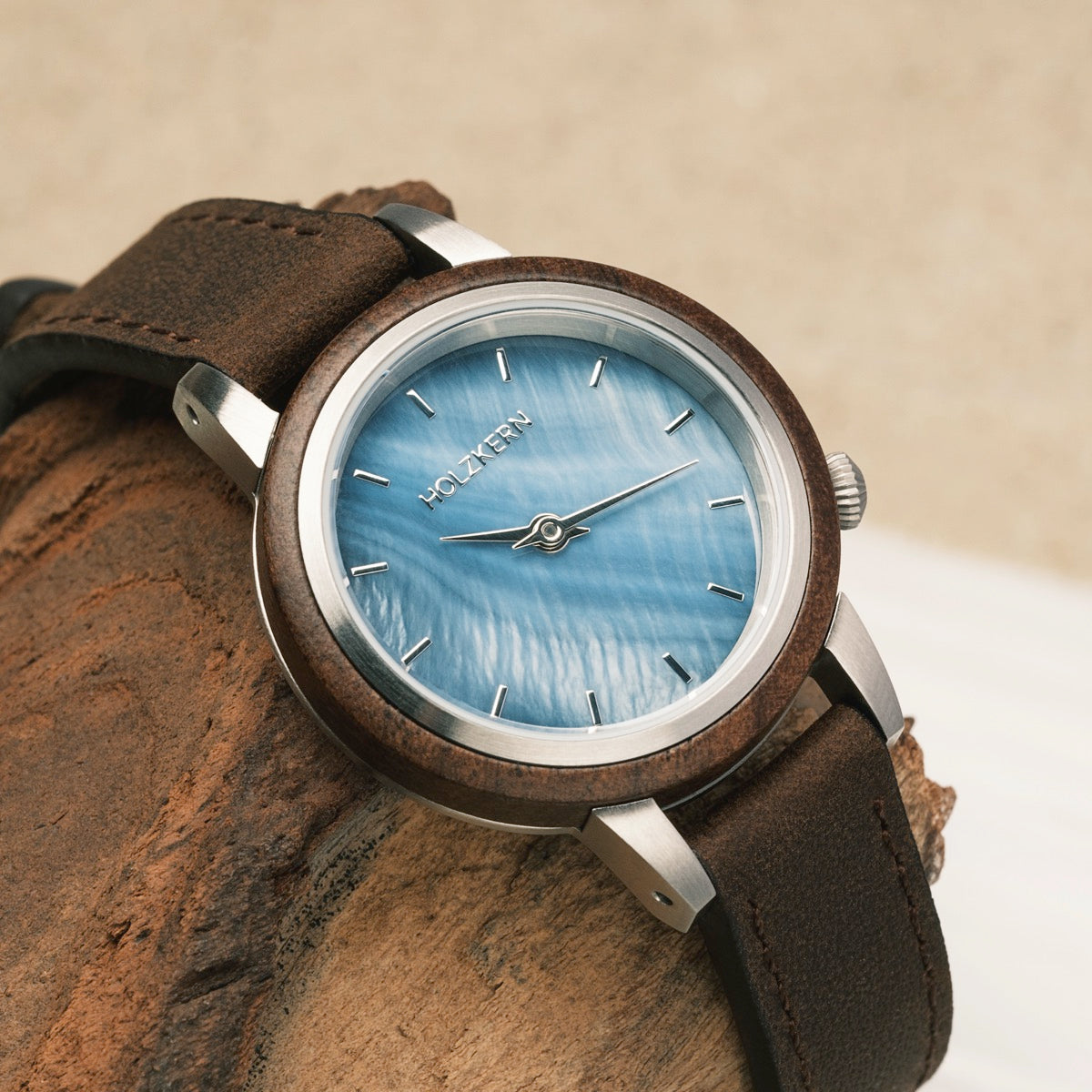 "Côte d'Azur" wristwatch featuring walnut wood and nacre details with a sleek, natural design.